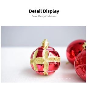 Detailed macro view of red Christmas ball with golden glitter cross texture and relief pattern