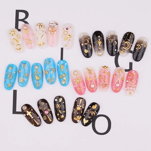 Star and moon metal studs nail art decor set with pink blue and black press-on nails