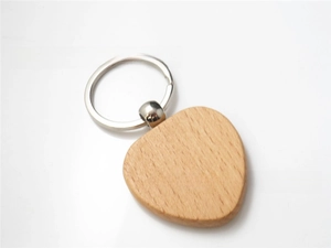 Detailed view of heart-shaped beech wood keychain with smooth natural wood grain finish