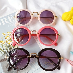 Three pairs of round kids UV400 sunglasses in pink and black with golden metal bridge