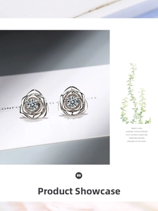 Detailed view of silver rose stud earrings with sparkling center cubic zirconia stones