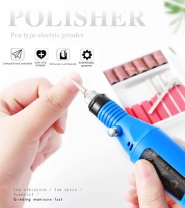 Macro view of blue electric nail polisher with silver metal bit for professional manicure