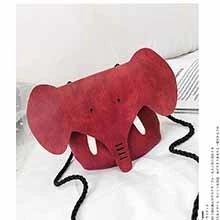 Detail view of red elephant crossbody bag in soft suede fabric with black woven strap