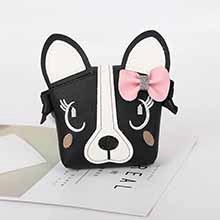 Detail showing cartoon Boston Terrier dog face with pink bow on plush shoulder bag
