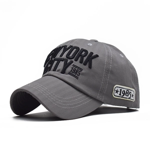 Detailed view of 3D New York City embroidery on grey cotton twill baseball cap