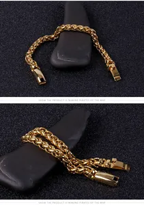 Close-up of golden stainless steel wheat chain bracelet with a textured fold-over clasp