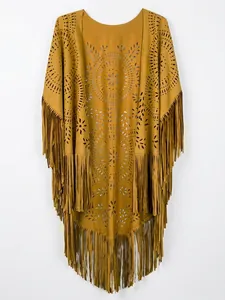 Detail of laser-cut openwork patterns and long tassels on mustard yellow suede cape