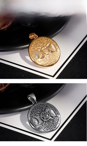 Macro detail of Tree of Life pendants with Moon and Pentagram in gold and silver finish