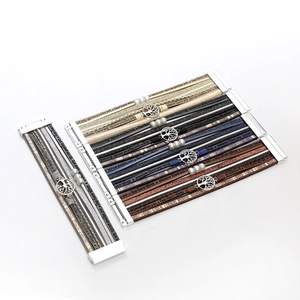 Detailed view of multilayer leather bracelet with tree of life charm and magnetic buckle