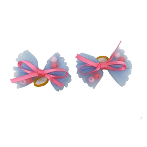 Detail of blue mesh and pink ribbon pet hair bows with beads and elastic bands