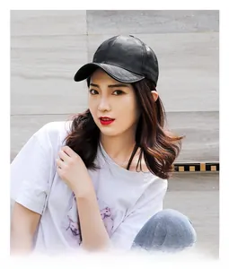 Close-up of black camouflage baseball cap with subtle jacquard pattern and curved brim