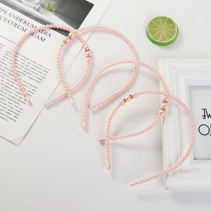 Elegant pink pearl headband for girls with gold accent beads and rhinestone details