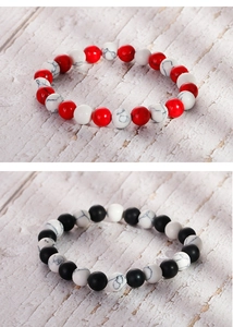 Detailed view of 8mm agate and turquoise beaded stretch bracelets in two-tone color patterns