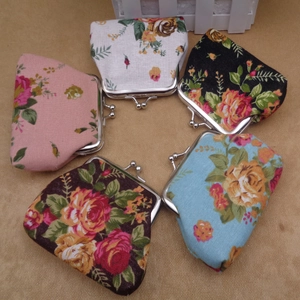 Detail of vintage floral canvas coin purses with retro metal clasp closures