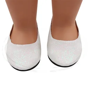 Detailed view of white glitter shoes on an 18-inch doll with sparkling finish