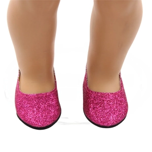 Macro shot of bright pink sequined doll shoes for 18 inch dolls with shiny glitter finish