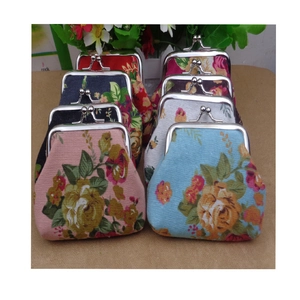 Vintage floral canvas coin purses with metal kiss-lock closures in multiple colors
