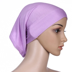 Detail of purple mercerized cotton underscap showing soft fabric texture on a mannequin
