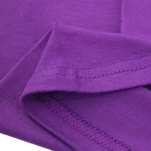 Close-up of premium purple mercerized cotton fabric with durable double-stitch seams