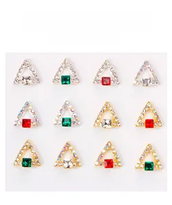 Macro shot of 12 luxury 3D triangle nail art charms with square rhinestones and gold base