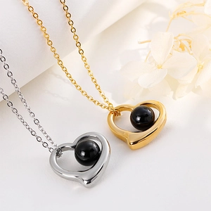 Minimalist heart pendant necklaces in gold and silver with black beads on O-chains