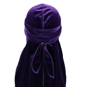Detail view of deep purple velvet durag with extra long straps and soft texture