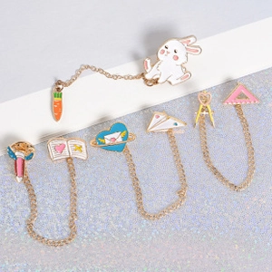 Detail of creative cartoon alloy enamel pins with metal chains and gold plating