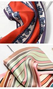 Detail shot of silk scarves featuring classic chain patterns and colorful stripe designs