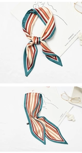 Close-up of a vintage striped skinny scarf styled as a neckerchief and flat lay detail