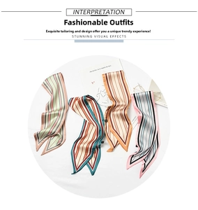 Detail of four colorful striped twilly scarves used as stylish neckerchiefs or bag charms