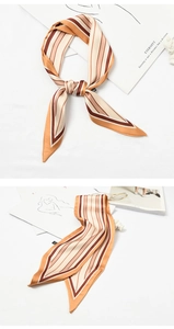 Detail of striped silk scarf with orange and brown tones for handbag decoration