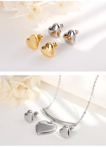 Detailed view of heart-shaped stainless steel necklace and stud earrings jewelry set