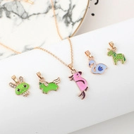 Set of five colorful enamel animal pendants including seahorse and giraffe for kids