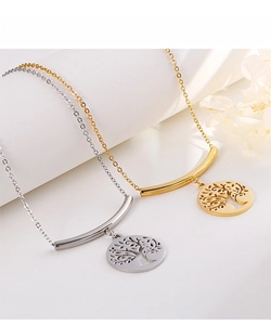 Close-up of gold and silver tree of life necklaces on elegant white display stands