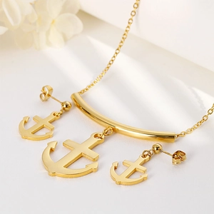 Golden titanium steel jewelry set featuring anchor pendant necklace and matching stud earrings