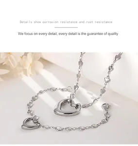Detailed view of silver heart-shaped pendant with lobster clasp and anti-corrosion chain