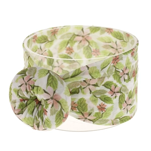 Detalle de diadema elástica de nylon para bebé con estampado floral y nudo de donut