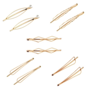 Set of 10 golden metal hair clips with minimalist geometric designs and pearl accents