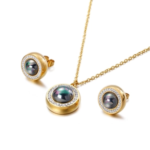 Elegant gold necklace and stud earrings set with iridescent pearls and zircon stones