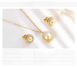 Detail of gold-plated necklace and stud earrings with shell pearl and zircon accents
