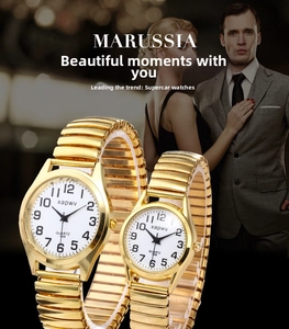 Detail of gold quartz watches for couples with stretch metal band and Arabic numerals