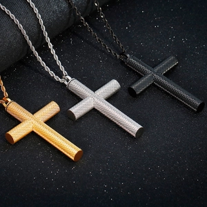Cross pendant necklace set in gold, silver, and black stainless steel with knurled texture