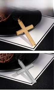 Detail showing gold and silver stainless steel cross pendants with knurled texture
