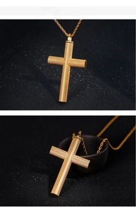 Close-up of golden cross pendant with diamond grid texture on a sleek rope chain