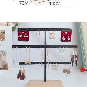 Three-tier black metal earring stand with wooden base showing 14cm width dimensions