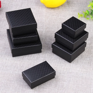 Set of black diamond texture jewelry gift boxes in various sizes on grey background