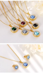 Detail view of gold crystal pendant necklace and earrings set with micro-pave diamonds