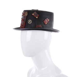 Detail of steampunk top hat featuring metallic gears and vintage red patches on black felt