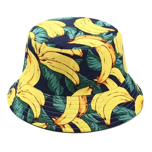 Detailed view of stitching and yellow banana pattern on navy blue cotton bucket hat