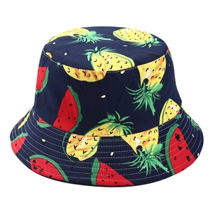 Women's dark blue bucket hat with pineapple and watermelon patterns on a white background